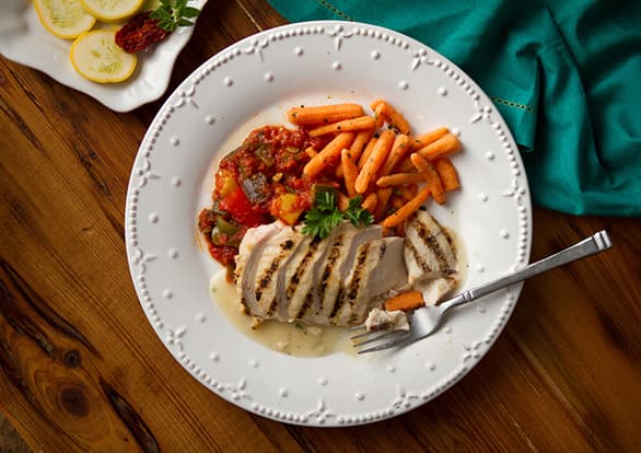 Grilled Chicken with Roasted Garlic Veloute Sauce. Recipe by bistroMD