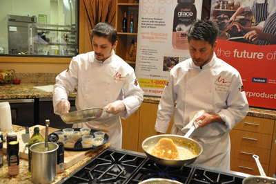 Majors Chris Enright and Three Squares Ryan Brown cooking one of the mouthwatering dishes using Major products