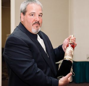 mark-roy-nhlc-spirits-marketing-specialist-holds-a-bottle-of-pappy-van-winkles-family-reserve-23yr-bourbon